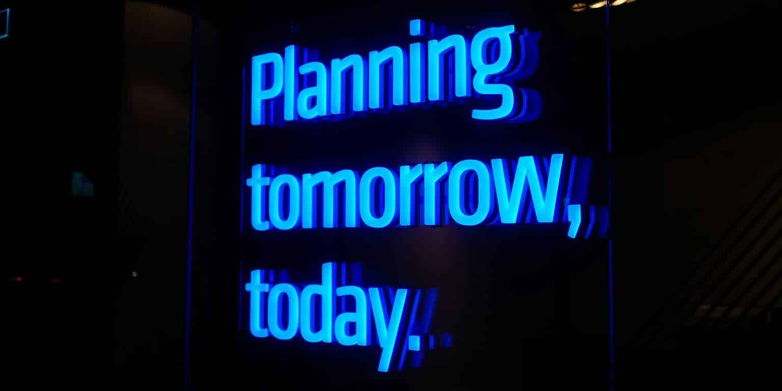 a neon sign that says planning tomorrow, today