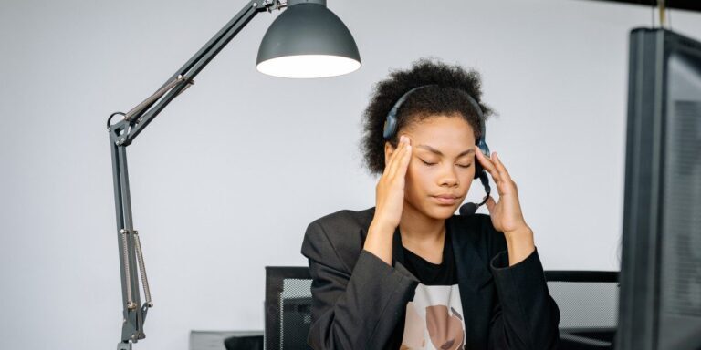 Photo of a woman feeling tired at work